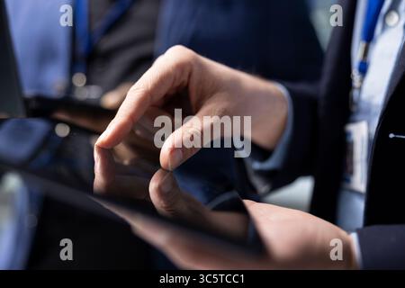Team of diverse male specialists working together in solar power factory, demonstrating inclusive teamwork and innovation for the production line. Industrial manufacturing process. Close up. Stock Photo