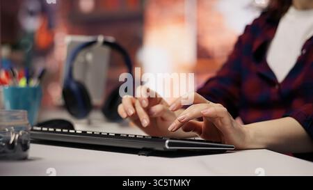 Startup engineer conducting detailed code review to fix bugs, identifying potential performance and technical issues with company software. IT worker debugging and optimizing code, camera B closeup Stock Photo