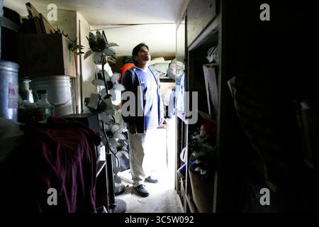 April 11, 2006, Huron, Ca, USA: HURON, CA- APRIL 12; Enrique (not his real name) , is a 35 year old undocumented farmworker from Mexico. To reach California, he paid a coyote $1200 and endured three straight days walking in the Arizona desert. His home, which was donated, is an overcrowded and moldy trailer. He is one of the lucky immigrants- others in town have to pay up to $400 a month for similar accomodations, with no running water or bathroom facilities. Although it is damp and cramped, he prefers the privacy over living in a shared room at the labor camps in town. About 39 percent of Hur Stock Photo