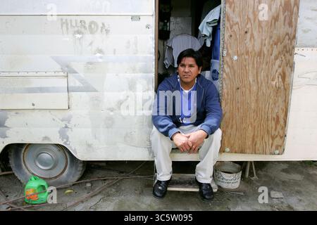 April 11, 2006, Huron, Ca, USA: HURON, CA- APRIL 12; Enrique (not his real name) , is a 35 year old undocumented farmworker from Mexico. To reach California, he paid a coyote $1200 and endured three straight days walking in the Arizona desert. His home, which was donated, is an overcrowded and moldy trailer. He is one of the lucky immigrants- others in town have to pay up to $400 a month for similar accomodations, with no running water or bathroom facilities. Although it is damp and cramped, he prefers the privacy over living in a shared room at the labor camps in town. About 39 percent of Hur Stock Photo