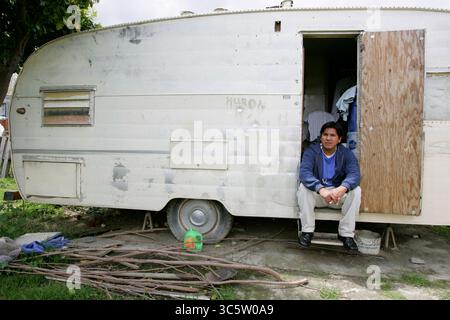 April 11, 2006, Huron, Ca, USA: HURON, CA- APRIL 12; Enrique (not his real name) , is a 35 year old undocumented farmworker from Mexico. To reach California, he paid a coyote $1200 and endured three straight days walking in the Arizona desert. His home, which was donated, is an overcrowded and moldy trailer. He is one of the lucky immigrants- others in town have to pay up to $400 a month for similar accomodations, with no running water or bathroom facilities. Although it is damp and cramped, he prefers the privacy over living in a shared room at the labor camps in town. About 39 percent of Hur Stock Photo