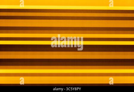 abstract background of blurred multicolored stripes in yellow green red pink and blue shades Stock Photo