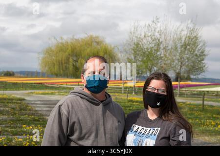 Kristal Mudge and her father Rick Mudge pose for a photo while wearing ...