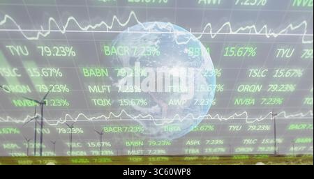 Displaying translucent Earth globe hovering over grassy wind farm plain, with stock data overlays Stock Photo