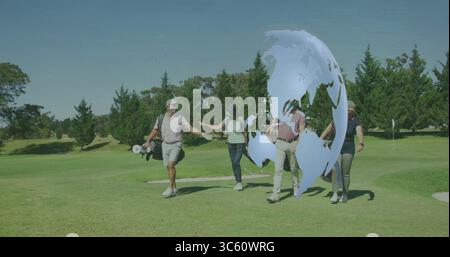 Walking four golfers carrying bags and exchanging high-fives on fairway, with digital globe overlay Stock Photo
