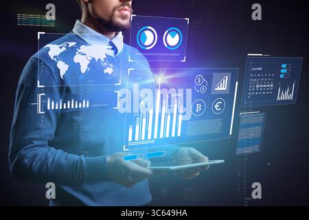 Professional analyzing data on a digital tablet with futuristic interface elements and global information Stock Photo