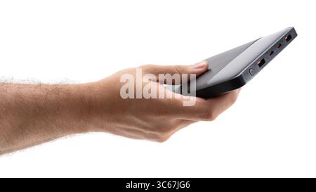 Hand holding a portable power bank for charging Stock Photo