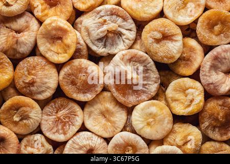 Natural organic dried figs fruit. Whole sun dried figs as a background. Stock Photo