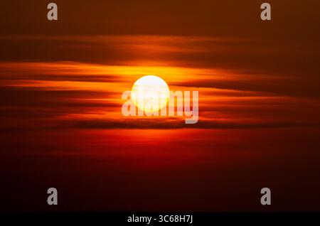 Dramatic sunset sky with red and orange hues, phase III Stock Photo
