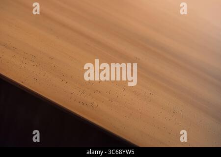 Close up of brass surface. Edge of brass top rectangular table. Stock Photo