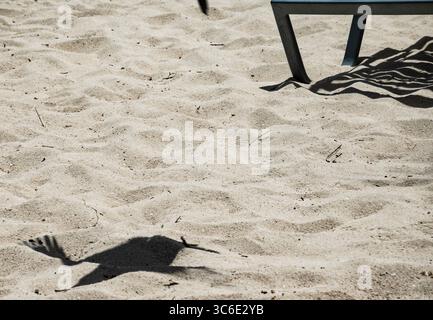 Silhouettes in the sand on the beach. Stock Photo