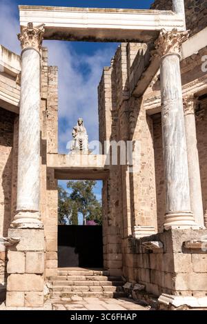 Marble statue of the roman goddess ceres sits atop the ruins of the roman theatre in mérida, spain Stock Photo