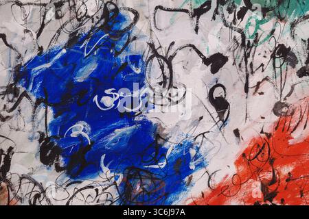 A close-up of a modern abstract expressionist painting, suitable for a texture or background. The artwork features chaotic black scribbles and lines l Stock Photo