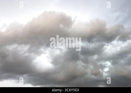 Dark discoloured storm clouds Cloud roll above grey clouds Rain clouds herald thunderstorms, international Stock Photo