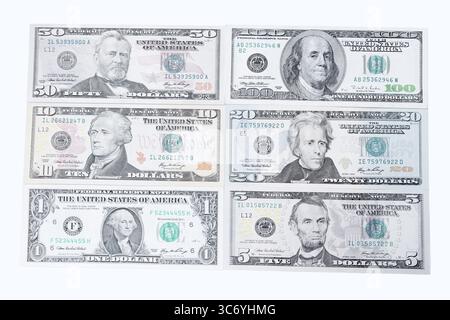 Various US dollar notes on white background, 1 dollar, 5 dollars, 10 dollars, 20 dollars, 50 dollars, 100 dollars, banknotes Stock Photo