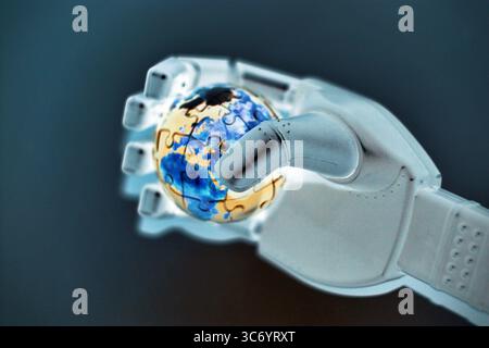 Artificial intelligence and technology shaping global future, robotic hand gently holding planet Earth on light background Stock Photo