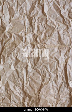 Brown crumpled paper provides a textured background, ideal for various design projects needing a vintage or natural aesthetic Stock Photo