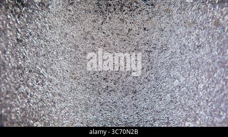 Texture of scratched stainless metal surface close-up. Stock Photo