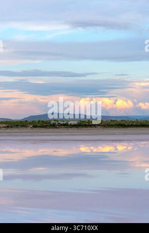Sunset reflecting over Tuz Lake in Turkey creating beautiful colours Stock Photo