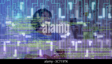 Standing engineer wearing red blazer examining holographic code display in lab, with LED panel Stock Photo