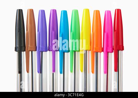 Multi colored ball pens on white background Stock Photo - Alamy