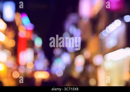 Urban background. Night neon lights, blurry big city with bokeh effect. Night abstract big city of Suwon, South Korea. Stock Photo
