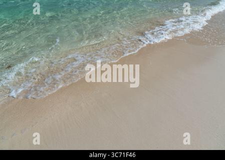 Turquoise colored ocean and sandy beach in Semporna, Sabah Borneo, Malaysia Stock Photo
