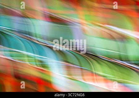 Light painting on stained glass made in motion. A gesture, a light, enough to end up completely blurred.  Movement No. 1651 Stock Photo