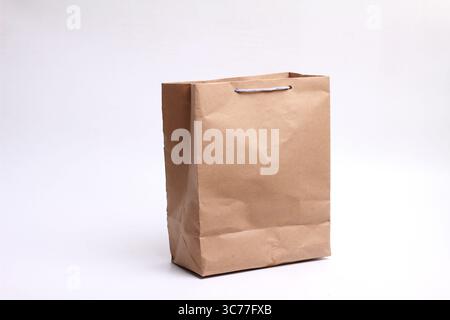 Brown paper bag isolated on white background. Stock Photo