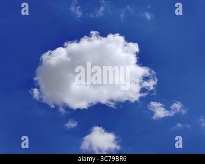 Fluffy white cloud in a blue sky, summer Stock Photo