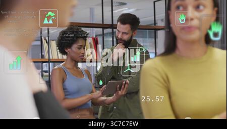 Presenting data charts Black woman holding tablet at modern office with floating icons, copy space Stock Photo