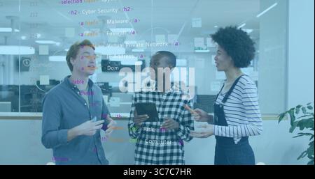 Collaborating IT professionals analyzing code on glass partition in office with tablet marker pen Stock Photo