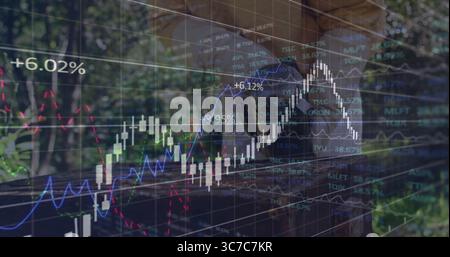 Displaying financial chart overlay tracking market at park, with candlestick bars and trend lines Stock Photo