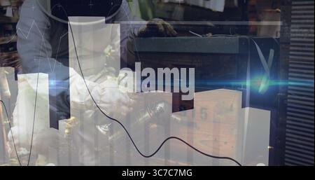 Planing carpenter wearing gloves and apron using hand plane in workshop with data analytics overlay Stock Photo