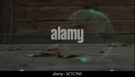 Floating holographic green data swirl hovering above wooden deck, with dried leaves and plank fence Stock Photo