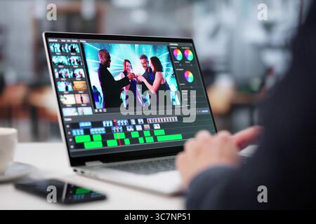 Young Graphic Designer Edits Video With Advanced Software On Laptop. Stock Photo