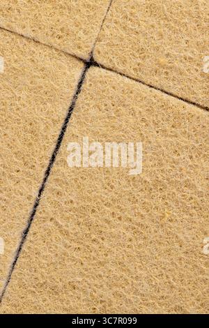 Many colored kitchen sponges on decorative colourful podium. Front view ...