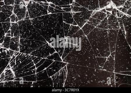 broken glass on a black background, thin glass broken into many pieces Stock Photo