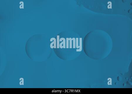 Minimal dark blue abstract bubbles. Minimalist dark blue bubbles on a deep monochrome background. Atmospheric modern abstract texture. Stock Photo