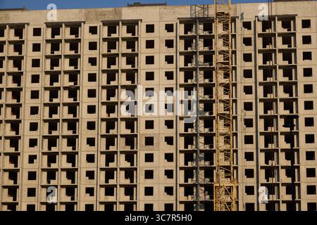 A bustling urban construction site featuring a prominently built concrete structure Stock Photo