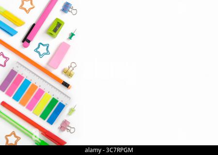 Creative layout made of neon colorful stationery set on white background. Space for your text Stock Photo