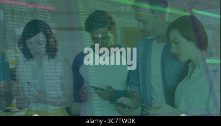 Reviewing six developers debugging projected code on glass wall at office, with smartphones tablets Stock Photo