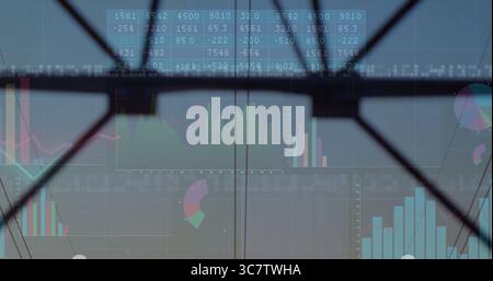 Displaying bar, line and pie charts, numeric table on glass panel in meeting room, steel beams Stock Photo