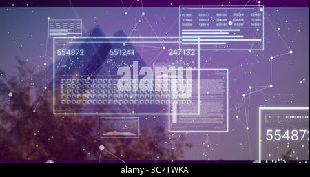 Displaying data panel showing charts with numbers overlaying tree-lined dusk sky, with network mesh Stock Photo