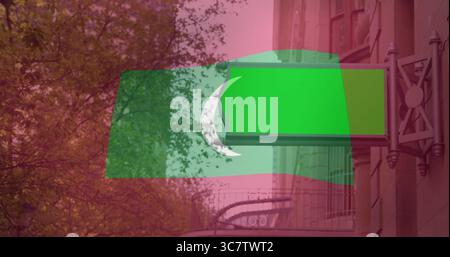 Displaying blank green signboard hanging on metal bracket over iron balcony railing on stone facade Stock Photo