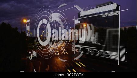 Projecting holographic interface over roadway at dusk, with circular HUD graphics, data panel Stock Photo