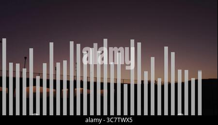 Stretching vertical white bars graphic overlay across walkway railing at dusk, with lampposts Stock Photo