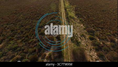 Displaying central overlay showing data rings over arid scrubland, with shield and envelope icon Stock Photo