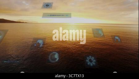 Displaying golden ocean glowing at seaside sunset, with holographic schematics and waveform panel Stock Photo