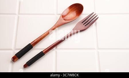 Spoon and fork, wooden cutlery Stock Photo